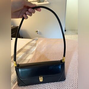 Black Leather Shoulder Bag with Gold Accents